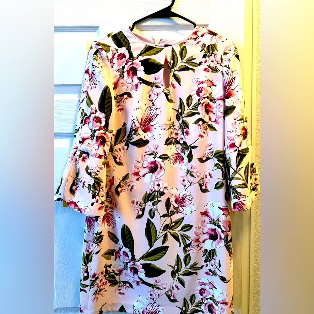 Beautiful carnation pink. 3/4 sleeves. Knee length.